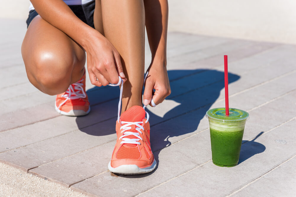 Woman Drinking Healthy Fruits After a Run